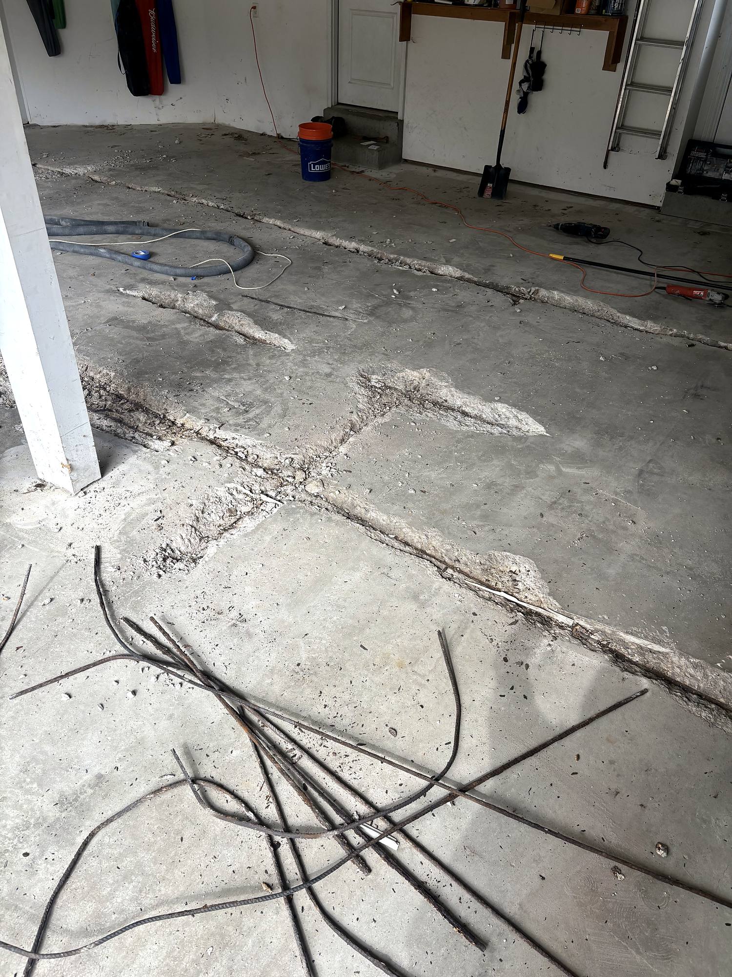 Close-up of cut concrete slab and rebar during crack repair