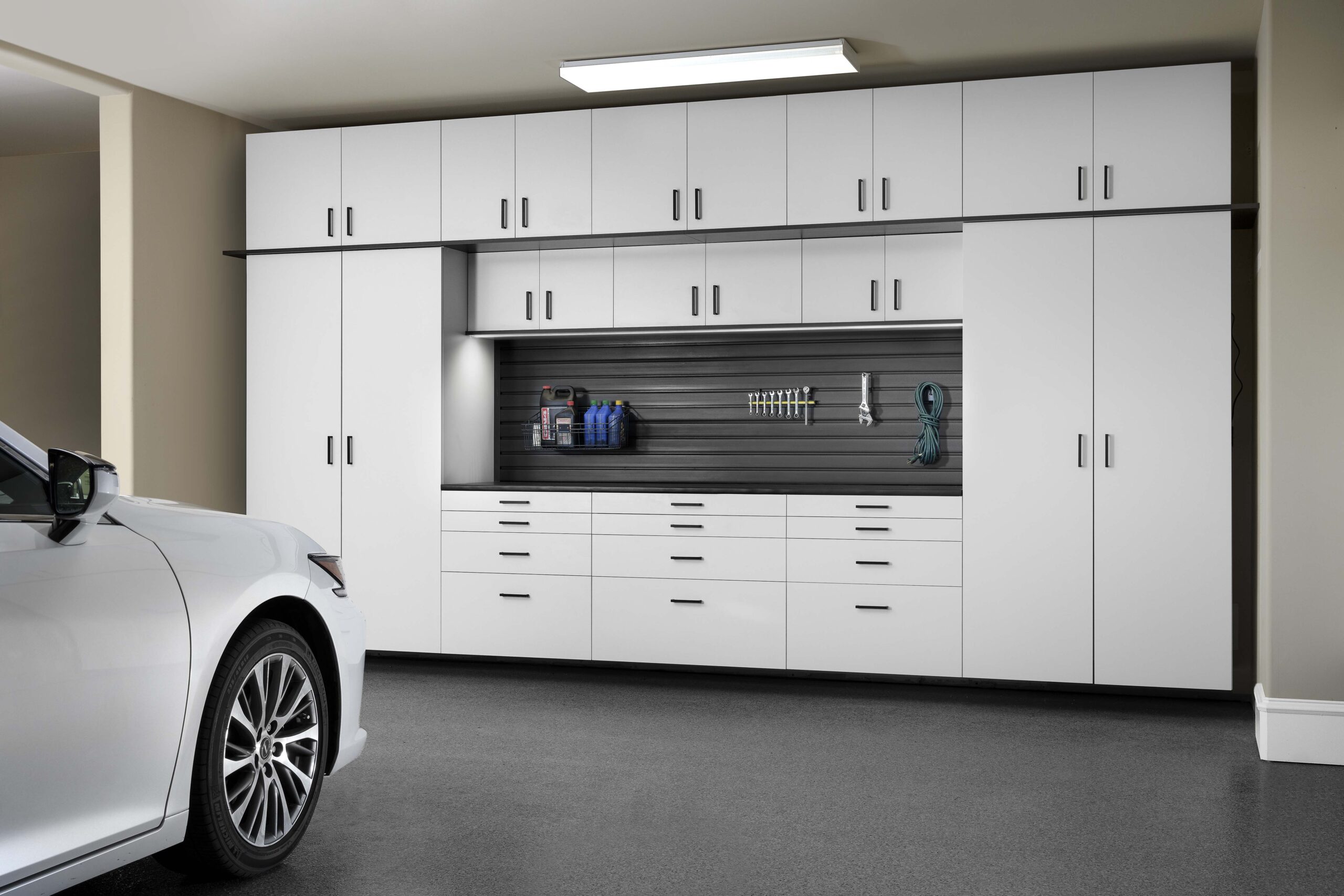 White custom garage cabinets with workbench